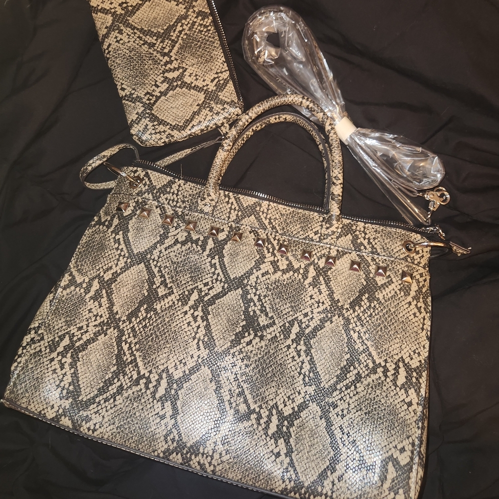 Carlos Santana bag and wristlet